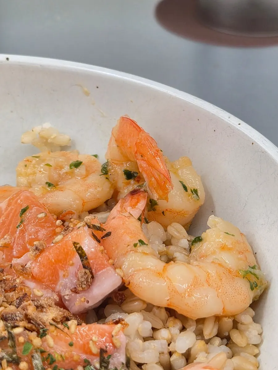 Salmon poke drizzled with recommended soy sauce