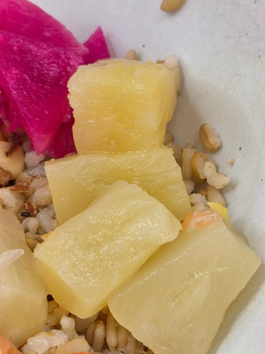 A bite of poke with chili garlic sauce