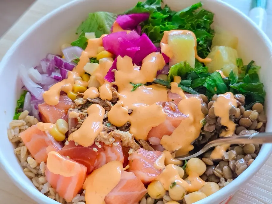 Close-up of salmon poke with salmon, veggies, and rice