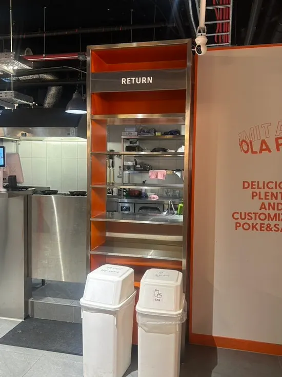 Tray return station set up in one corner of the restaurant