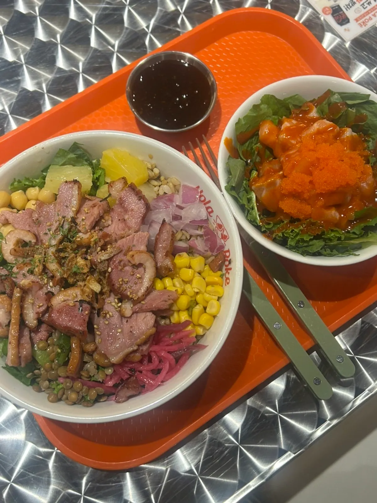 Table set with smoked duck poke and buldak salmon kkakdugi