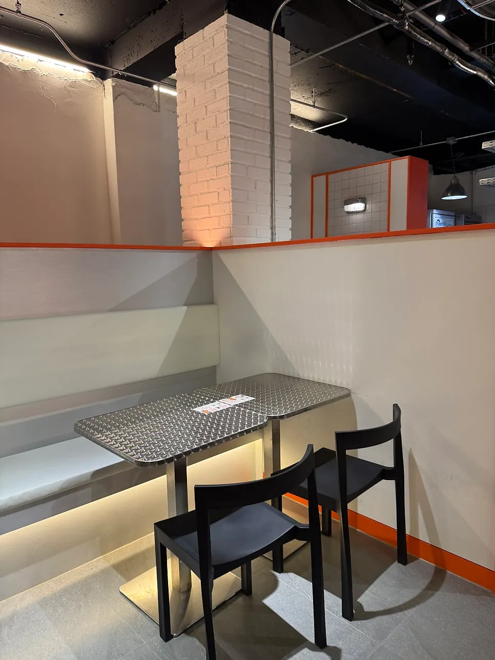 Two-person and four-person tables inside the restaurant