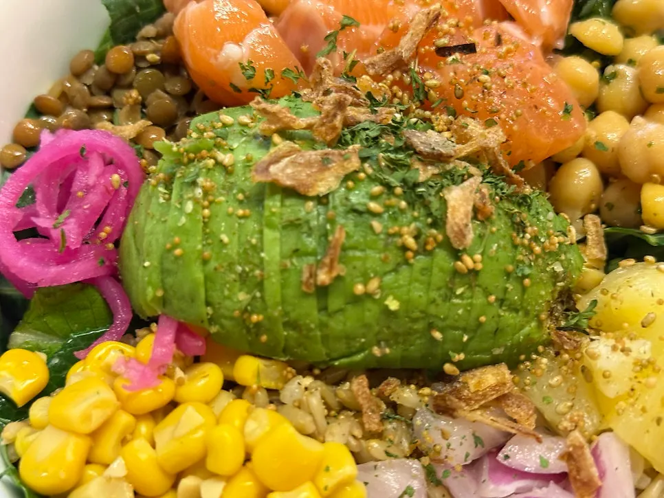 Close-up of poke drizzled with sriracha mayo sauce