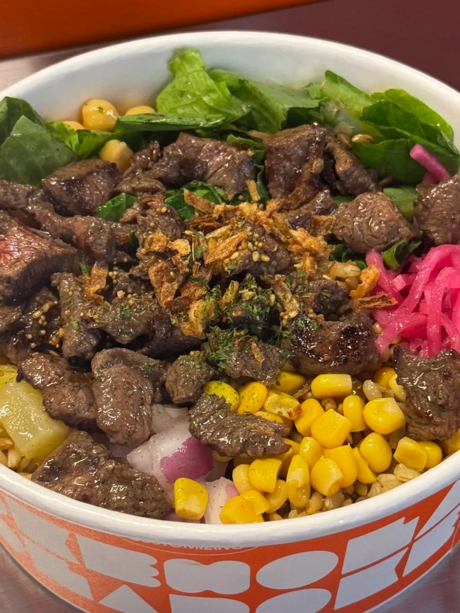 Mixing the poke bowl together