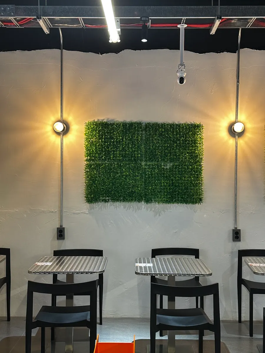 Store interior with a cat logo visible on the wall