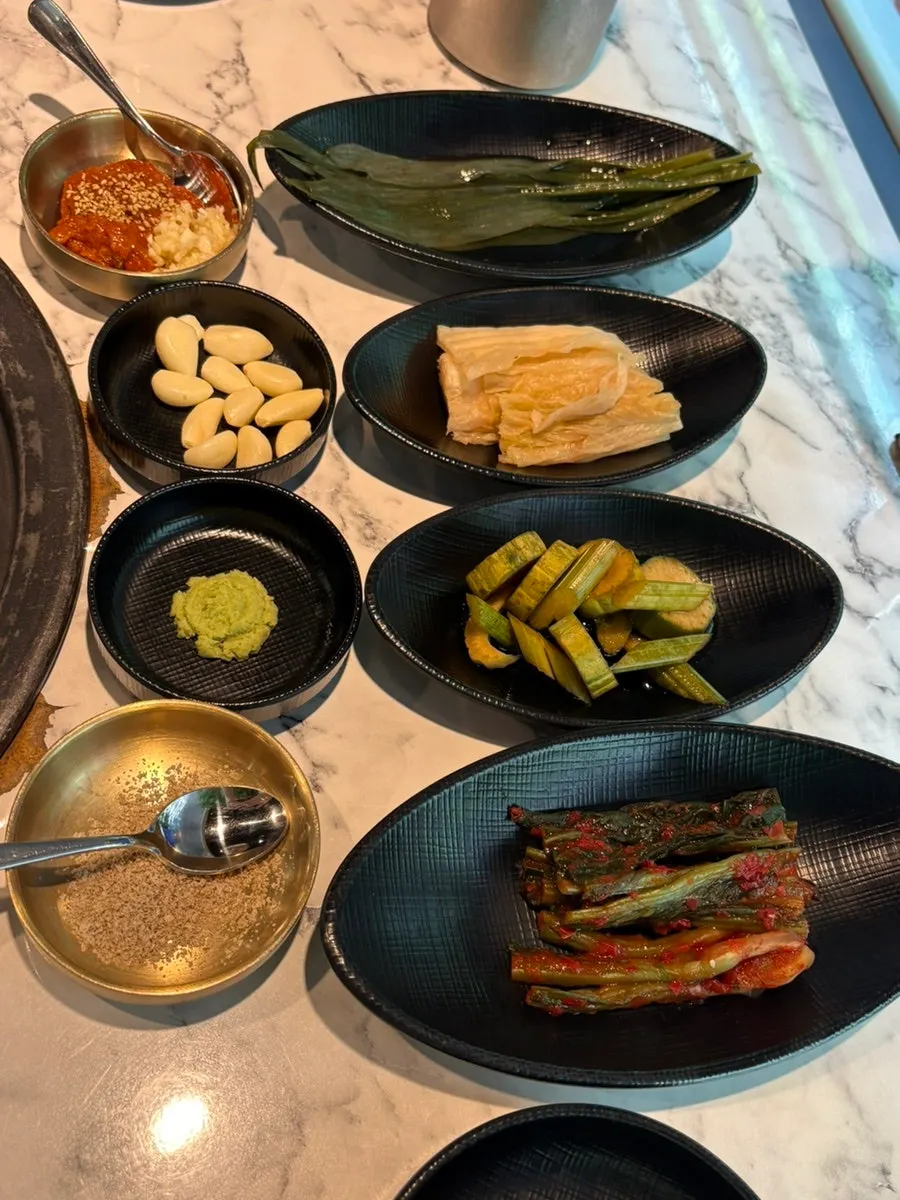 Salt, ssamjang, garlic, and wasabi accompaniments