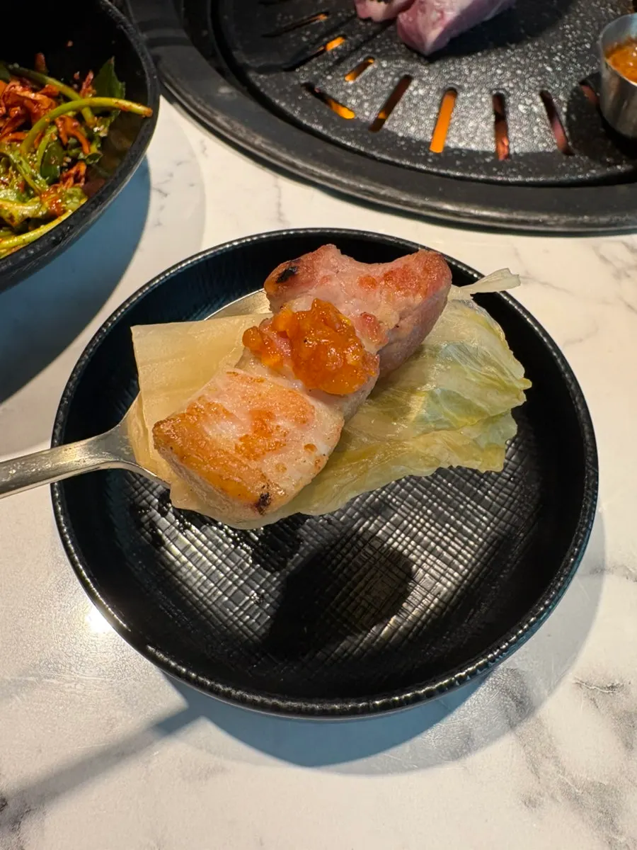 Pork belly cut into easy-to-eat pieces on the grill