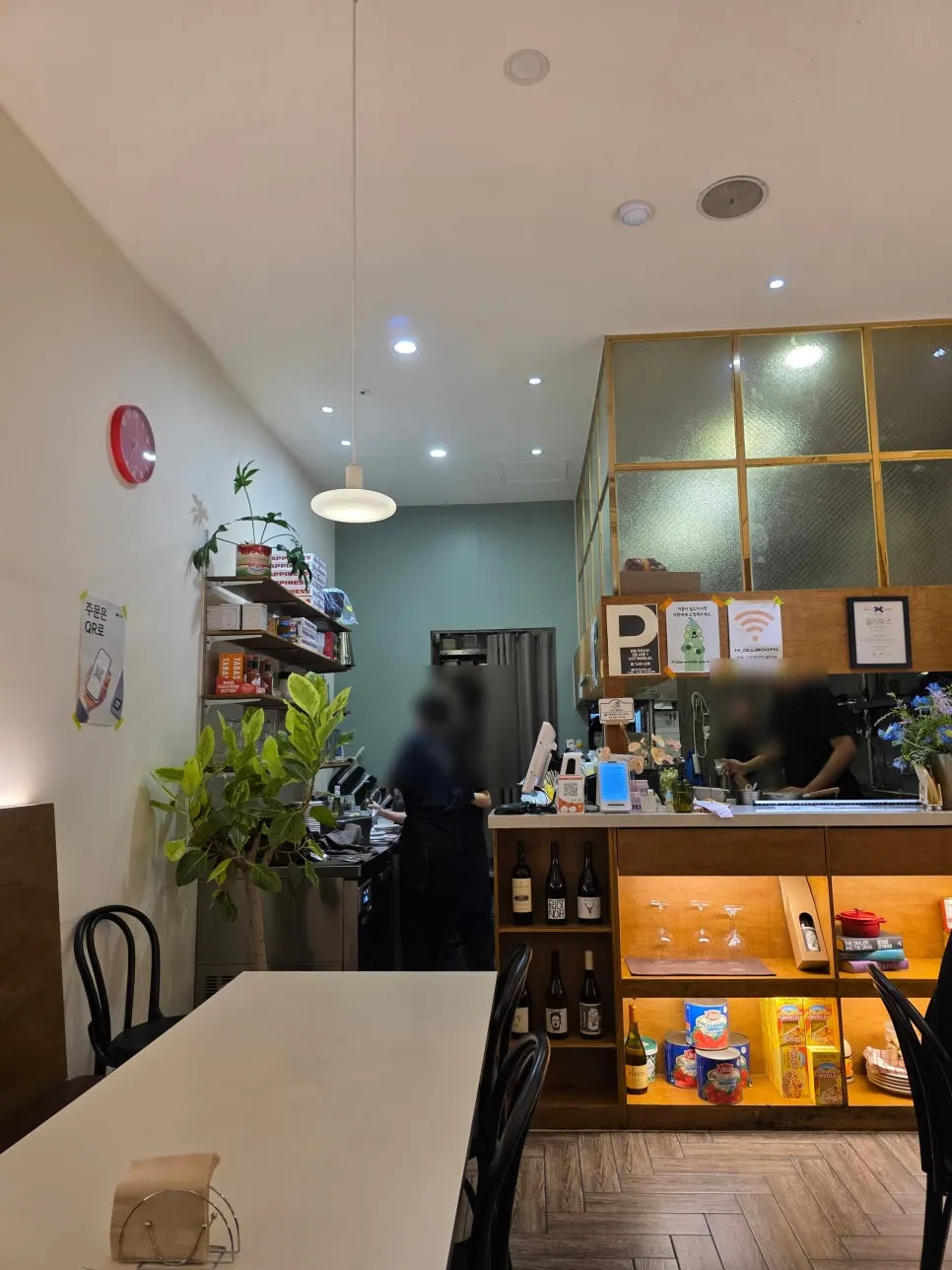 Restaurant interior decorated with oil painting frames and wall lighting