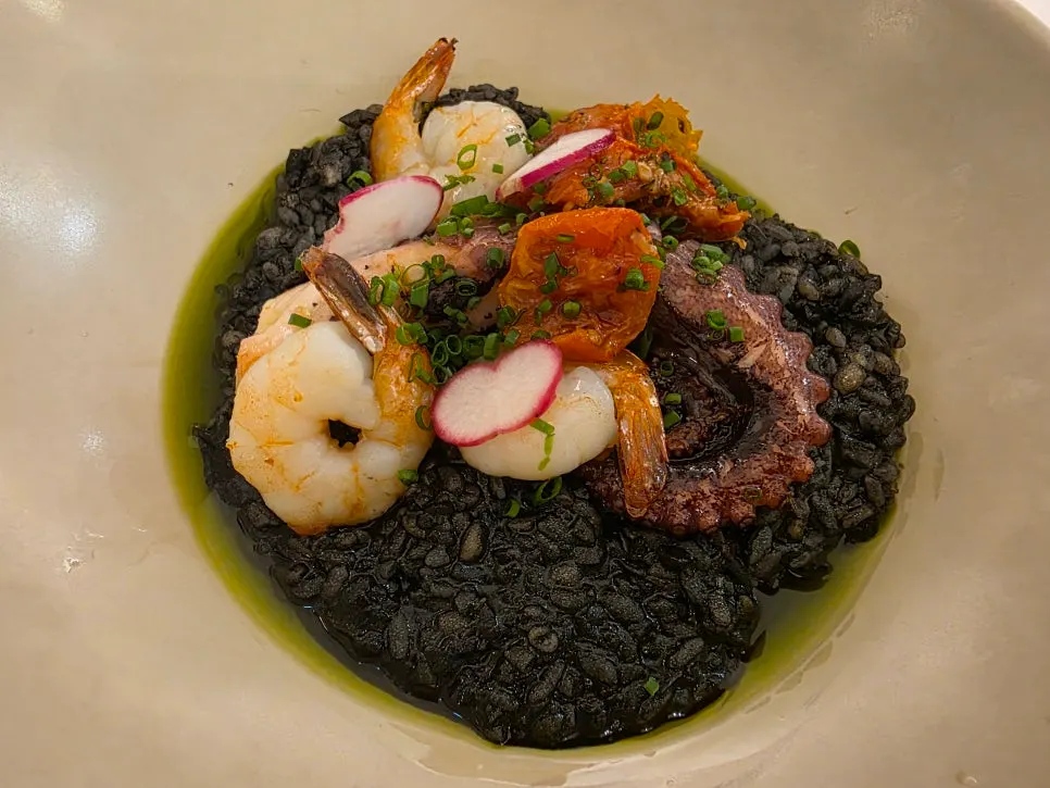 Close-up of the steaming squid ink risotto