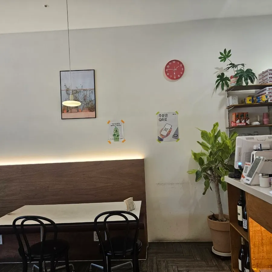 Inner part of the restaurant with a partly open kitchen visible