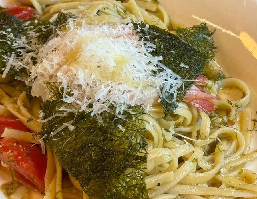Close-up of oil pasta topped with gamtae and sweet shrimp