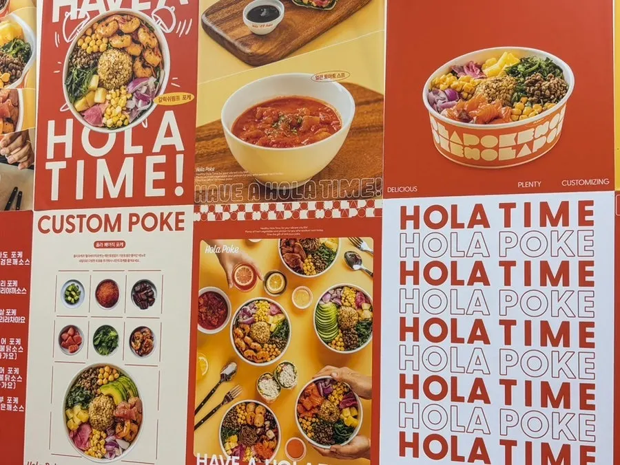 The orange Ola Poke Gangnam storefront inside the shopping passage