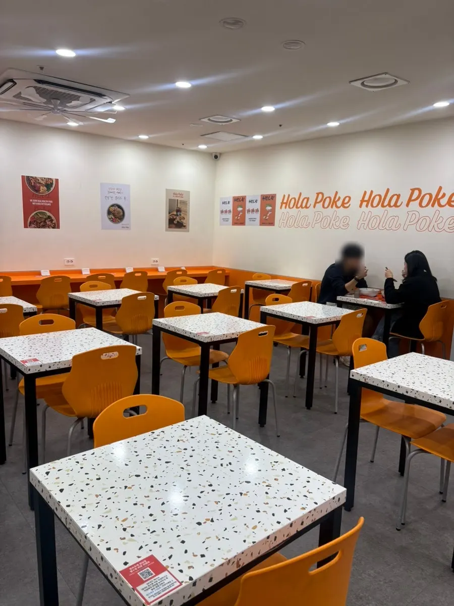 Interior of Ola Poke Gangnam with many tables