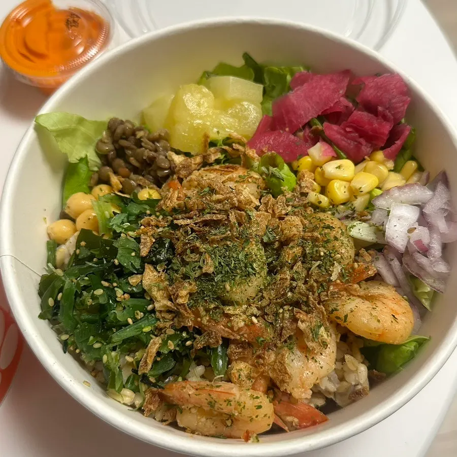 Smoked duck topping on the poke bowl