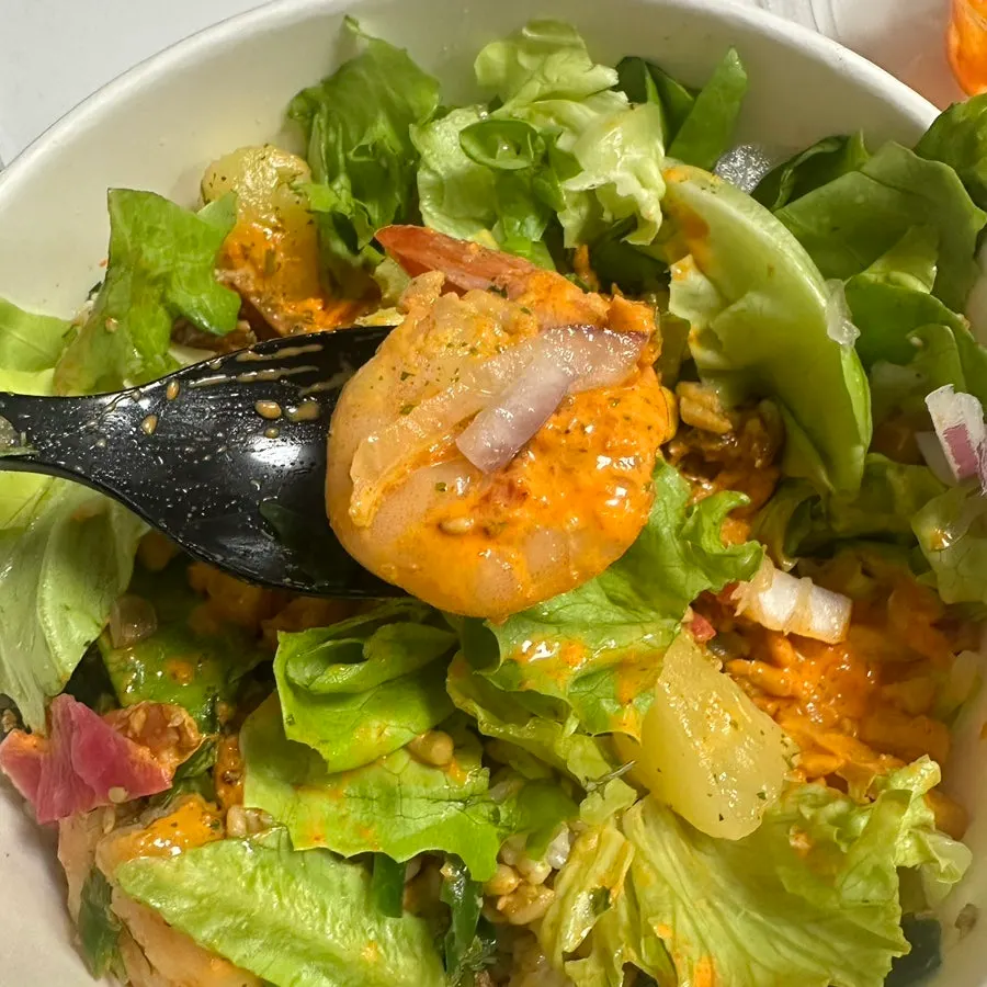 Poke bowl mixed with sauce