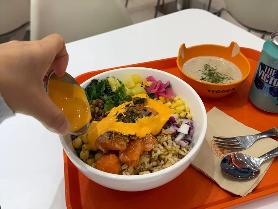 Salmon poke drizzled with the recommended sauce