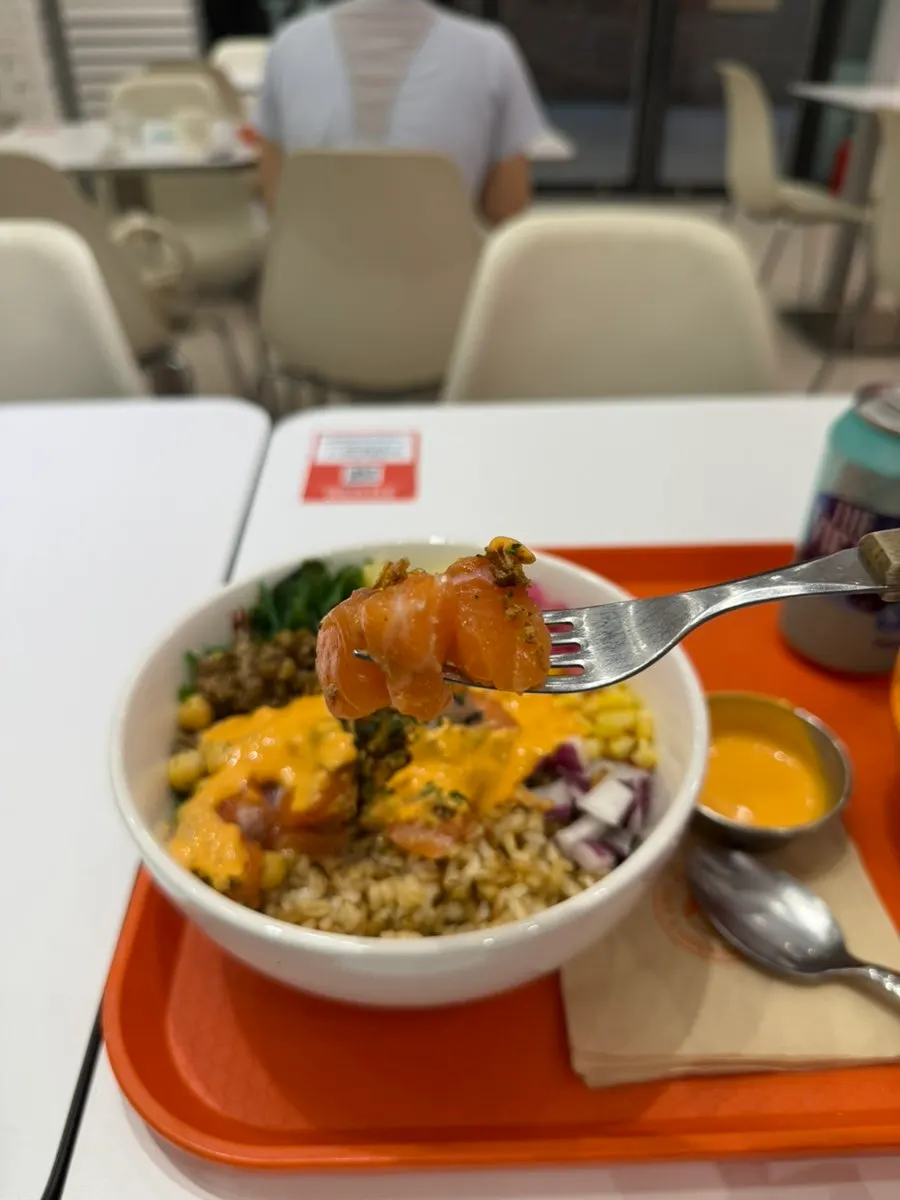 Poke mixed together with salmon, vegetables and rice