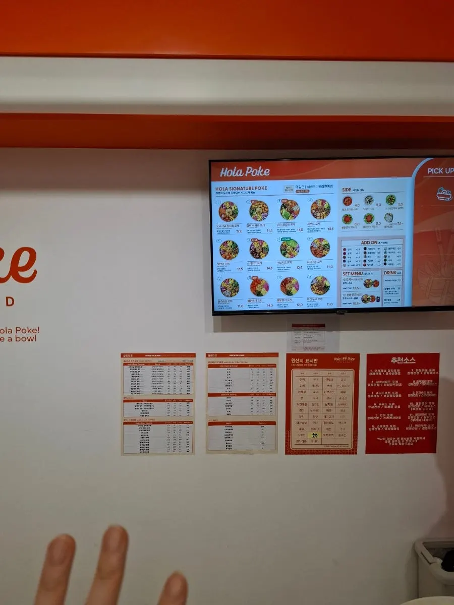 Poke takeout packed in coated paper bowls