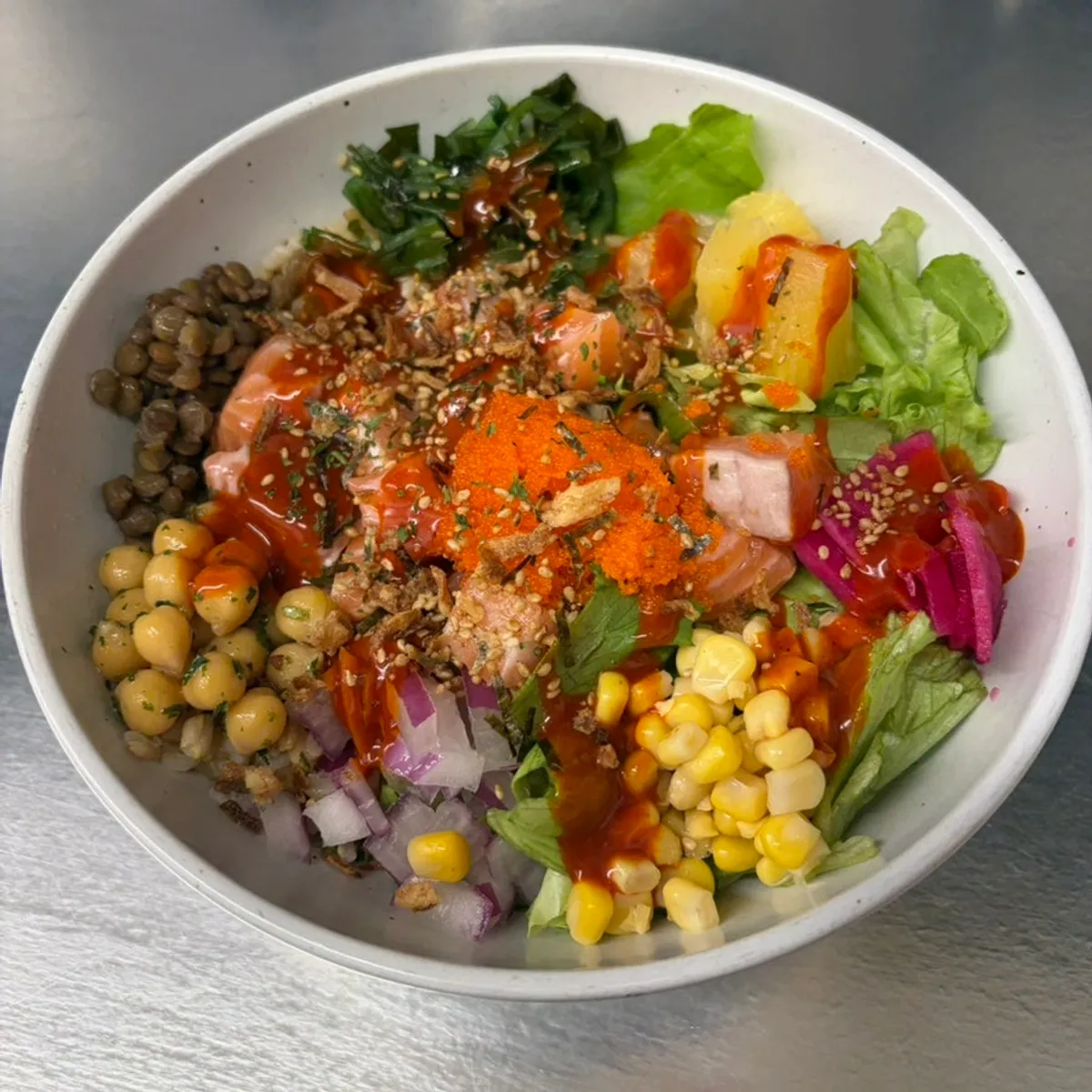 A bowl of buldak salmon poke at Ola Poke Samseong Branch