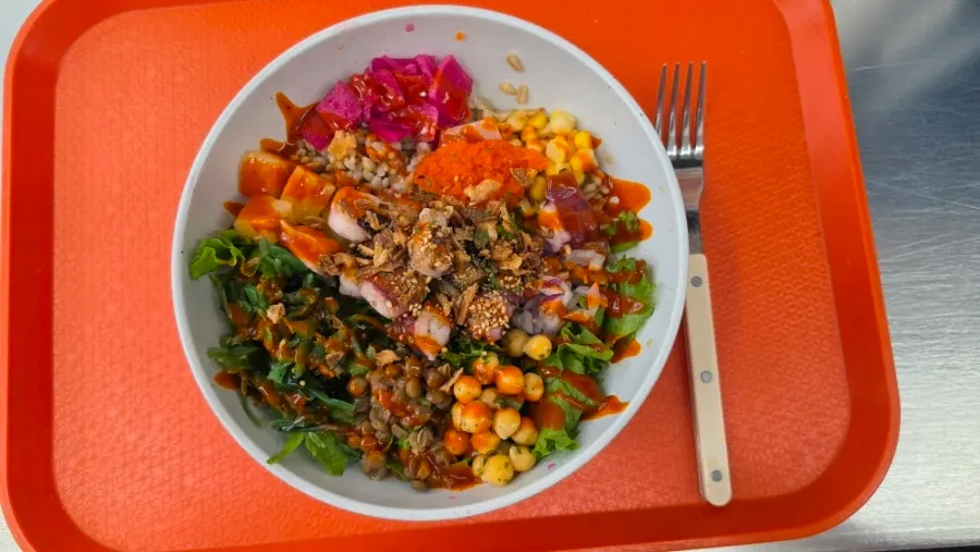 Buldak octopus poke topped with big chunks of octopus