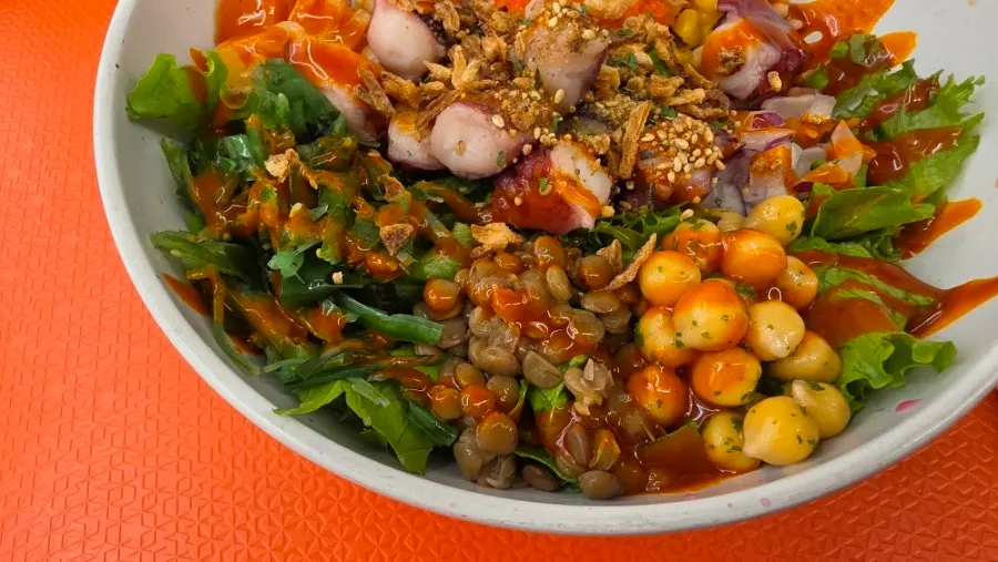 A bite combining crunchy vegetables and chewy octopus
