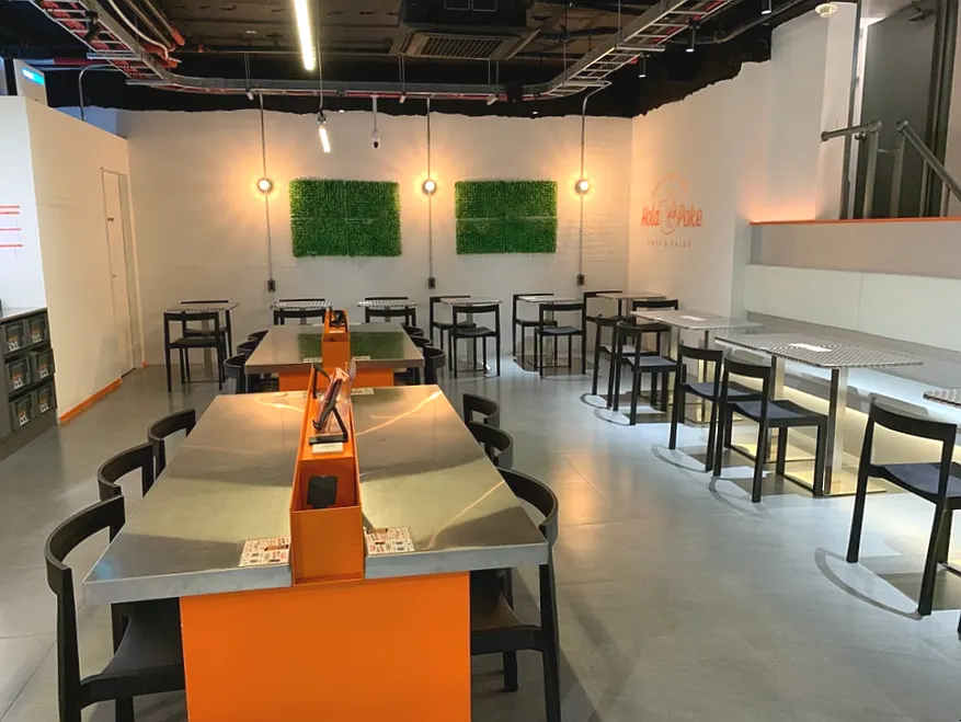 Quiet store interior of Olla Poke late in the evening
