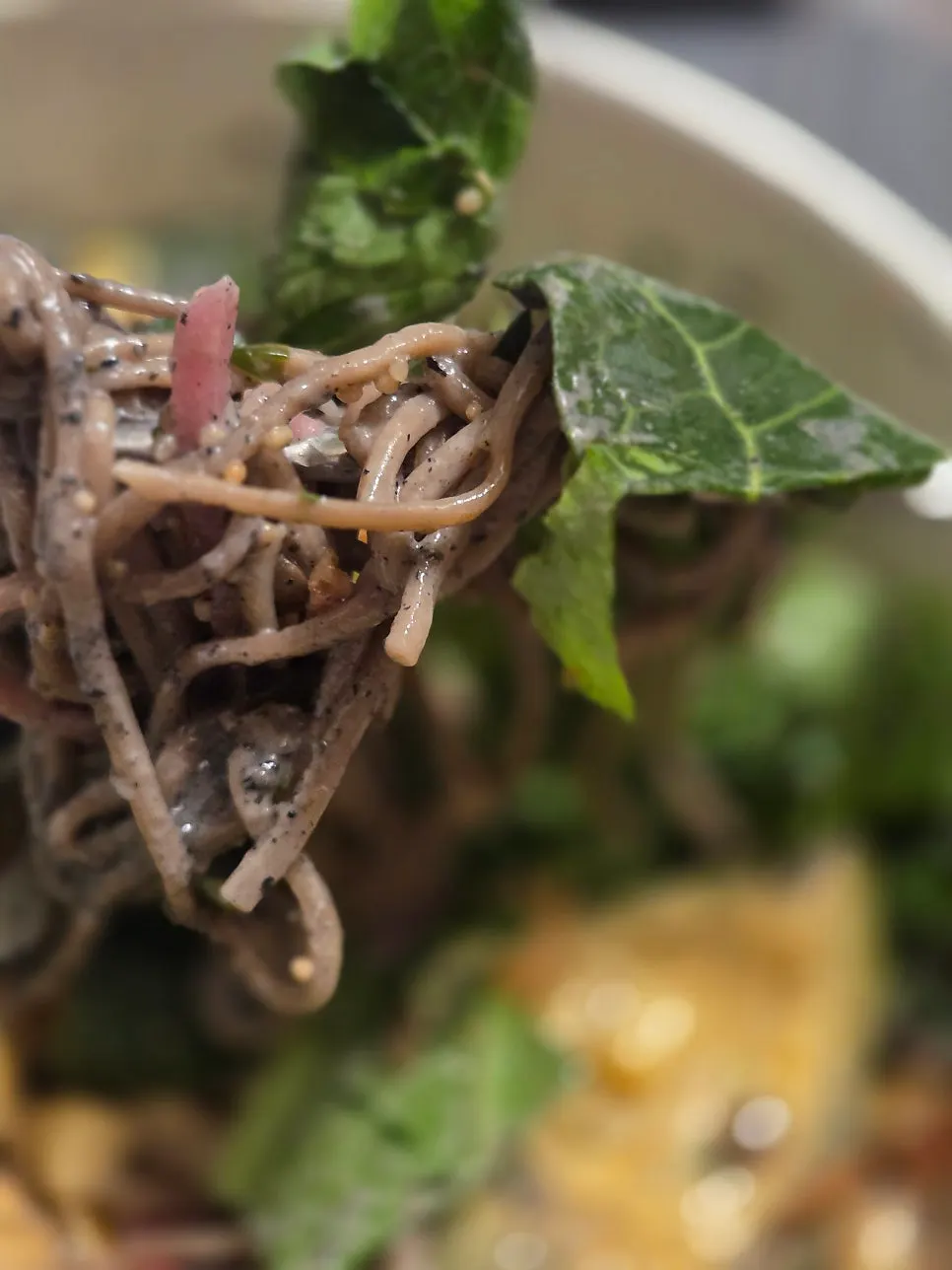 Avocado poke served with vegetables and noodles