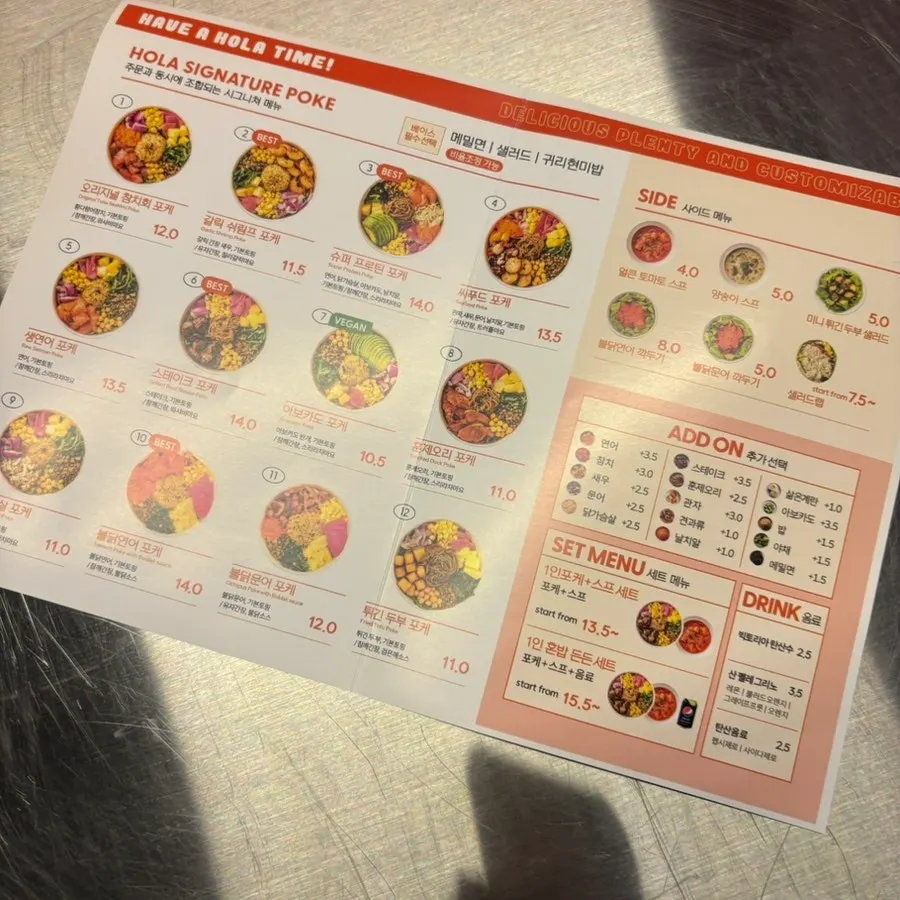Signage showing takeout and delivery options at Olla Poke