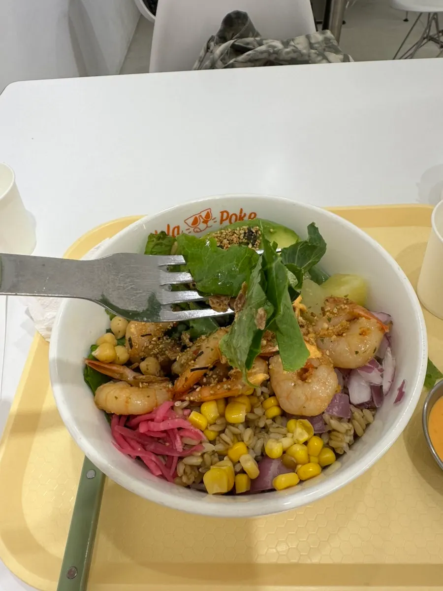 Poke bowl generously filled with fresh vegetables