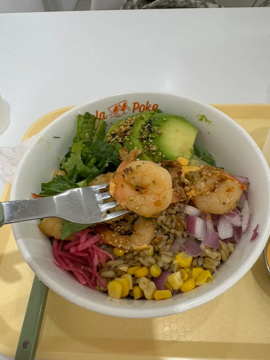 Close-up of poke showing corn and garlic shrimp