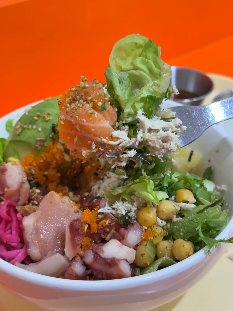 Poke bowl with standard toppings like corn and chickpeas