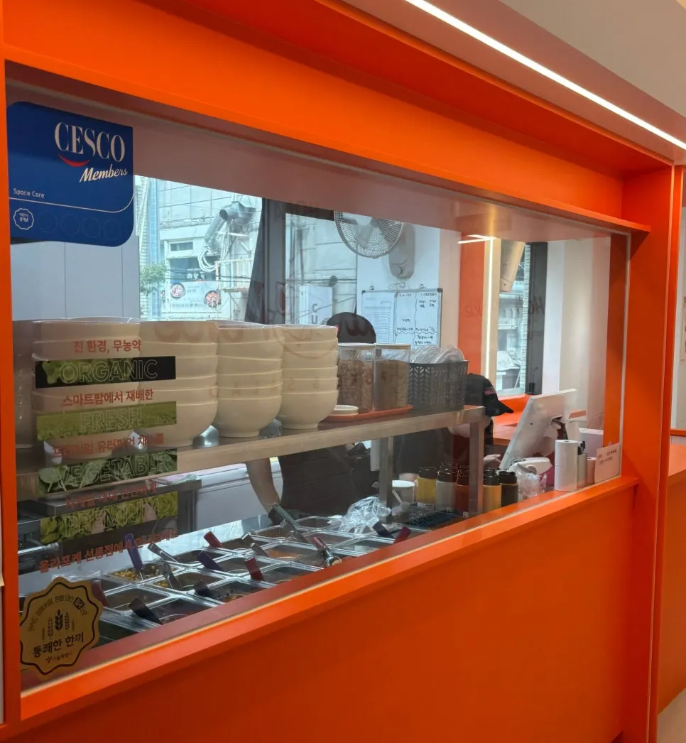 Orange-toned interior of Hola Poke Seolleung Branch