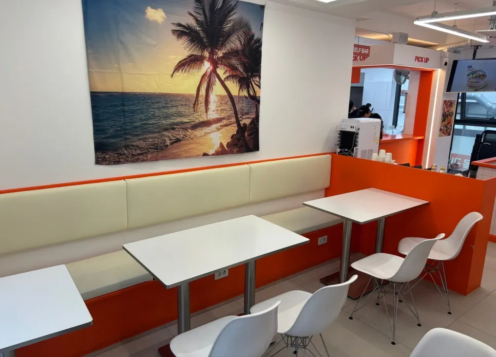 Seating with 4-person tables toward the back