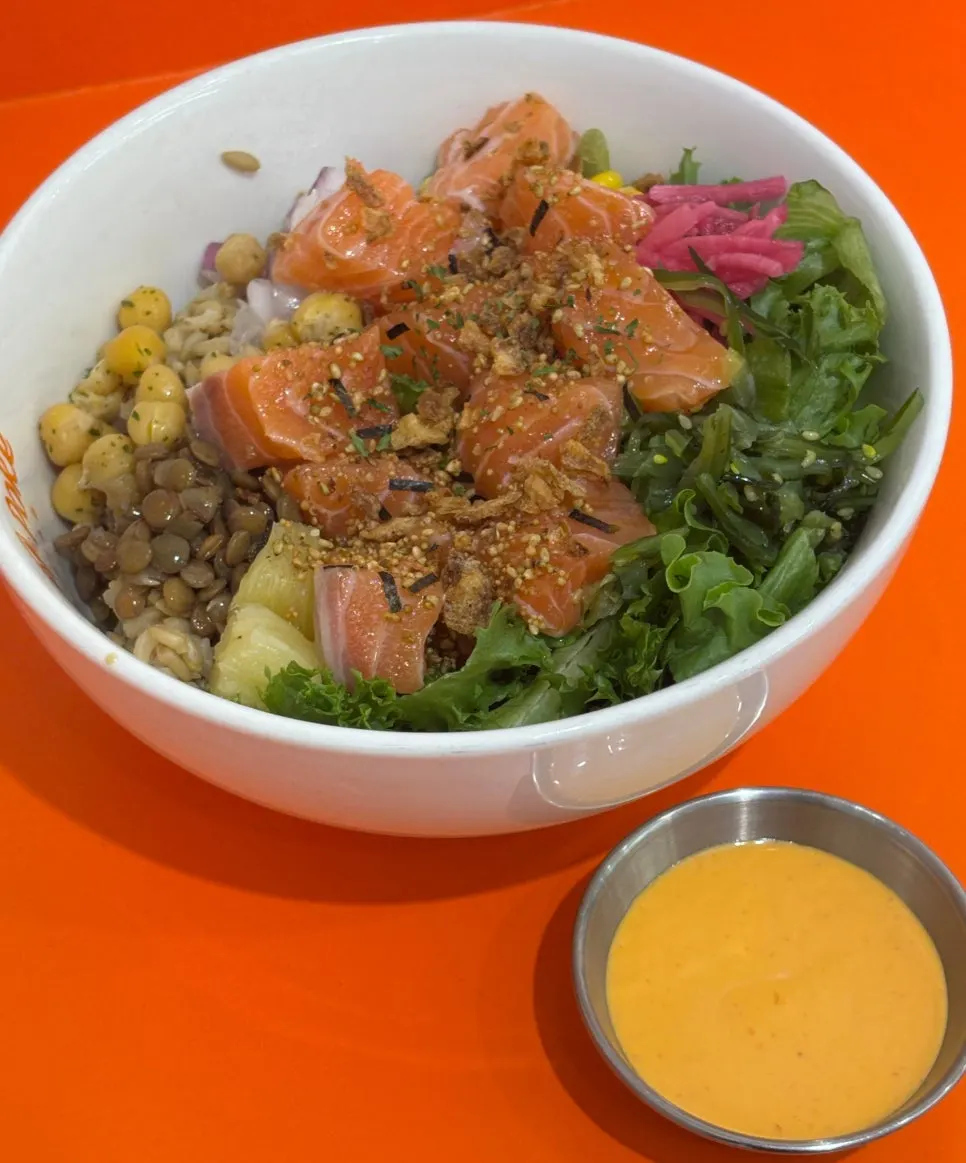 Raw salmon poke placed at the table