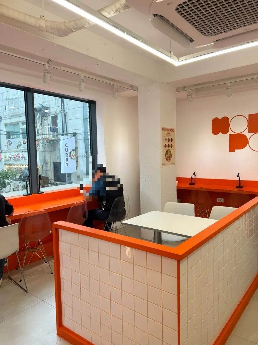 Clean interior seating at the poke restaurant