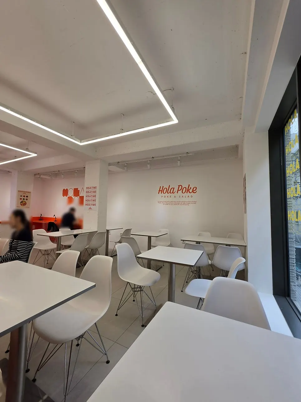 Interior of Hola Poke Seolleung Branch decorated in orange and white