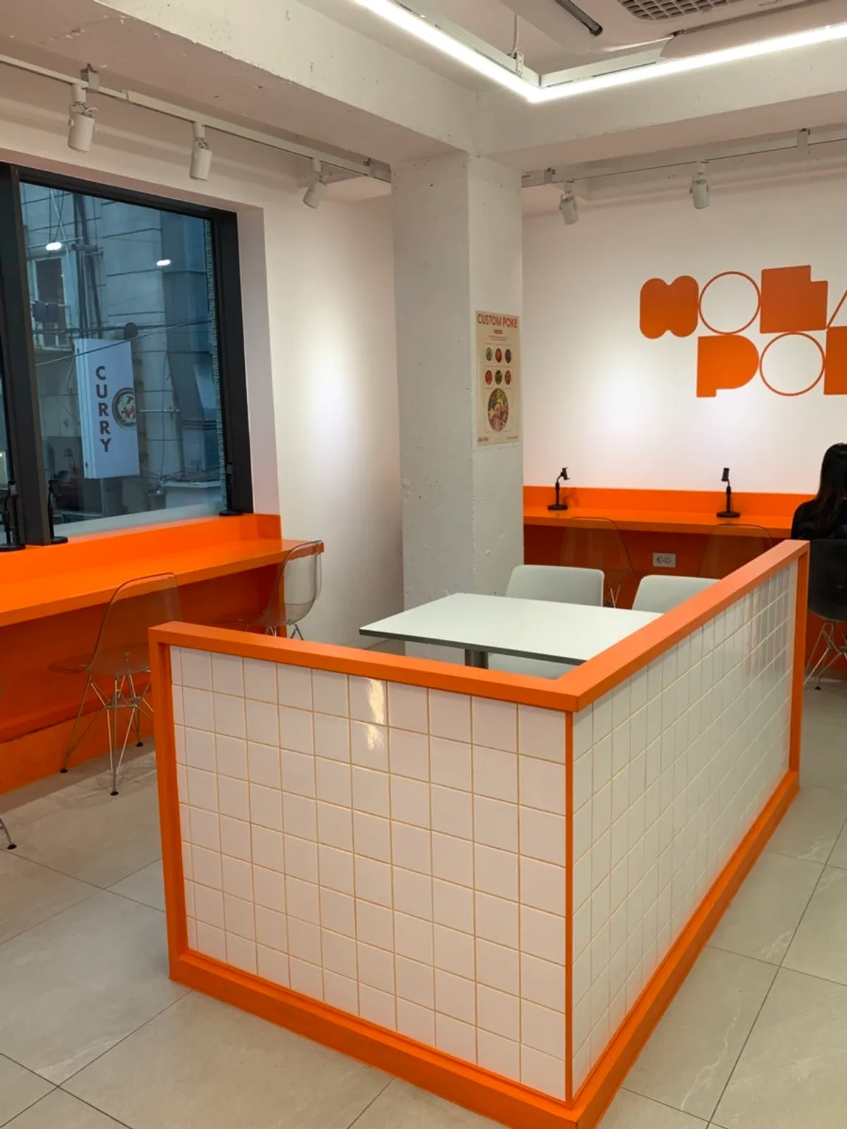 Bright interior of the store in orange and white tones