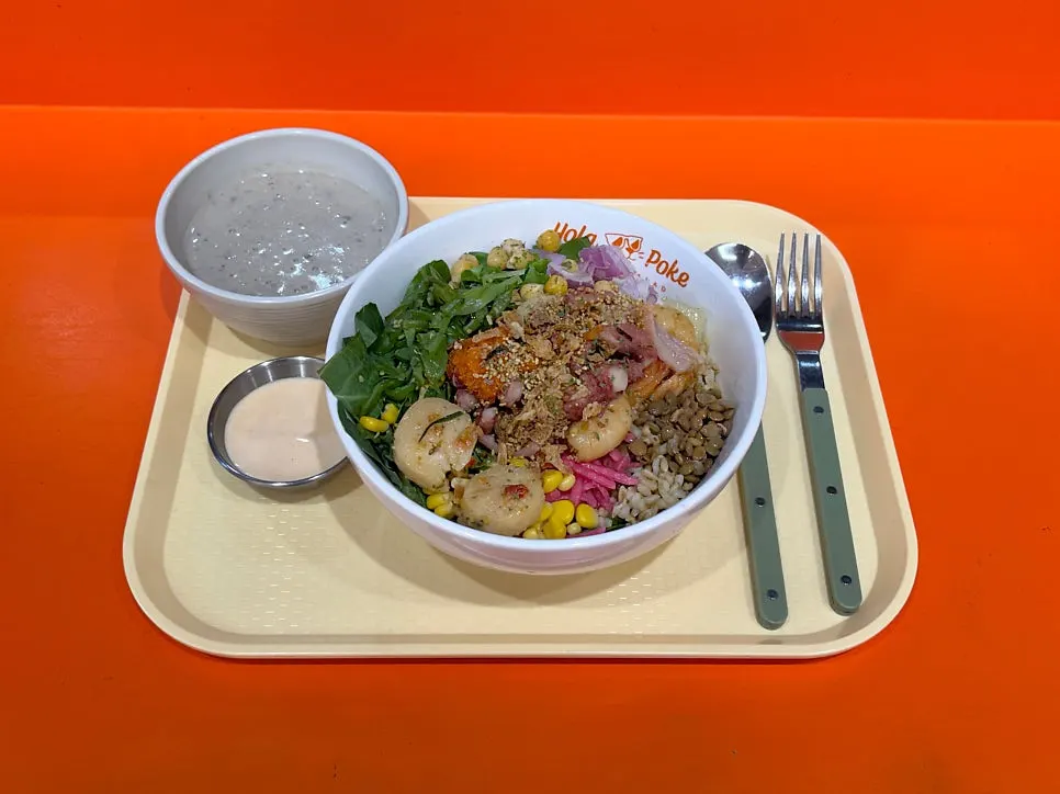 Seafood poke topped with seafood at Hola Poke