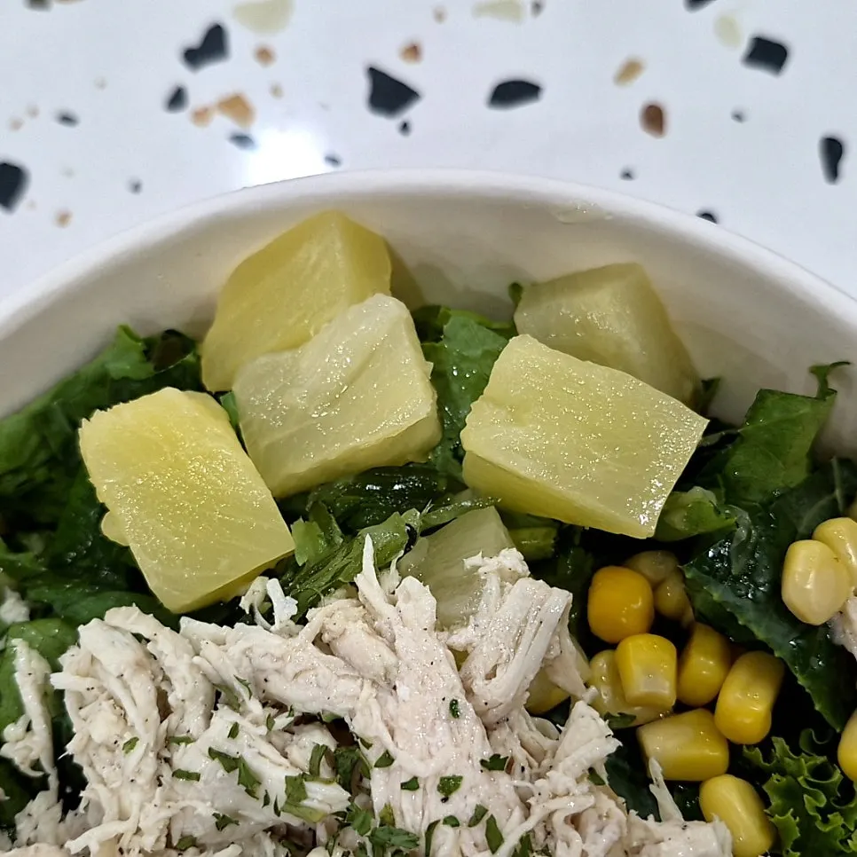 A close-up of the toppings on the chicken breast poke