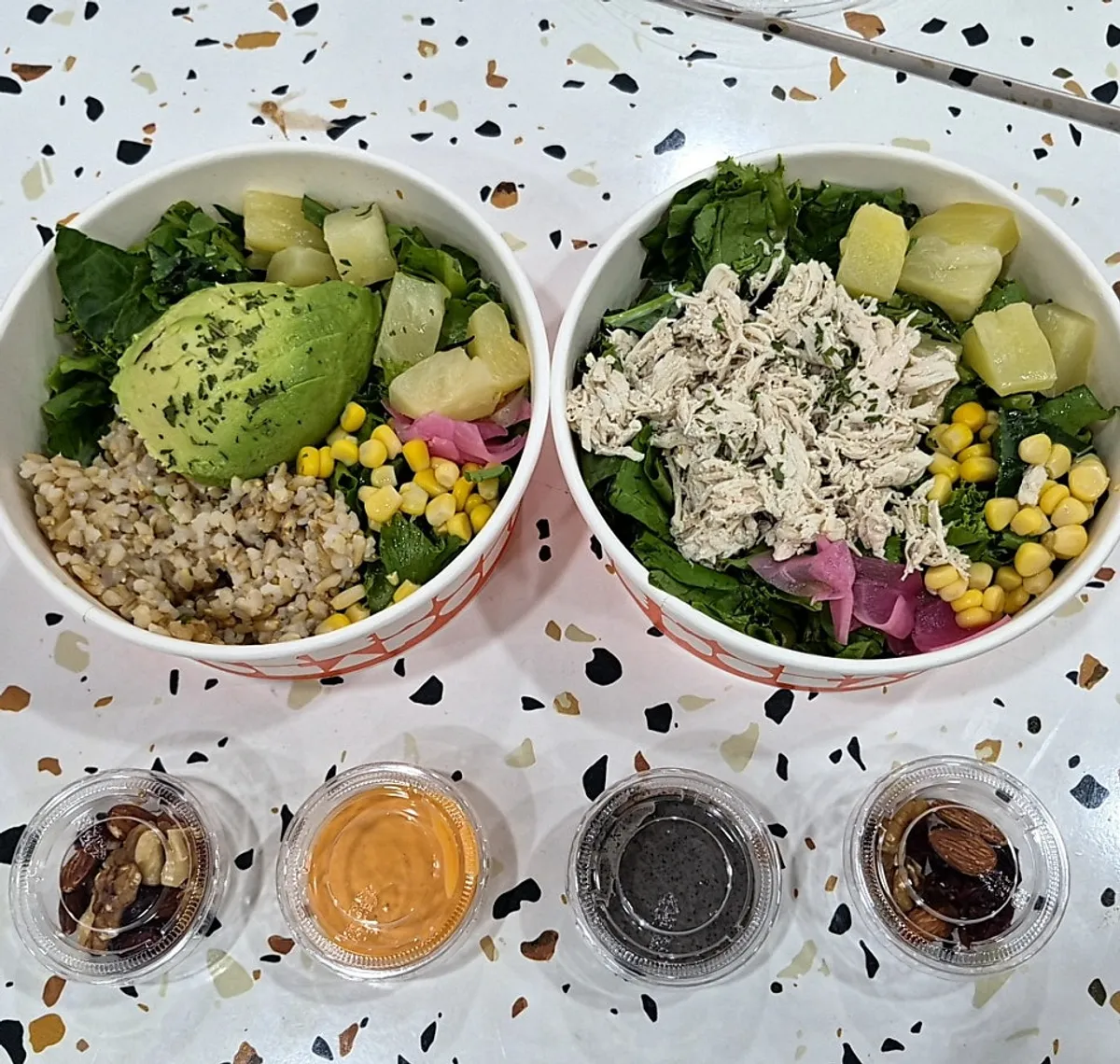 Two bowls, chicken breast poke and avocado poke, from Ola Poke Gangnam