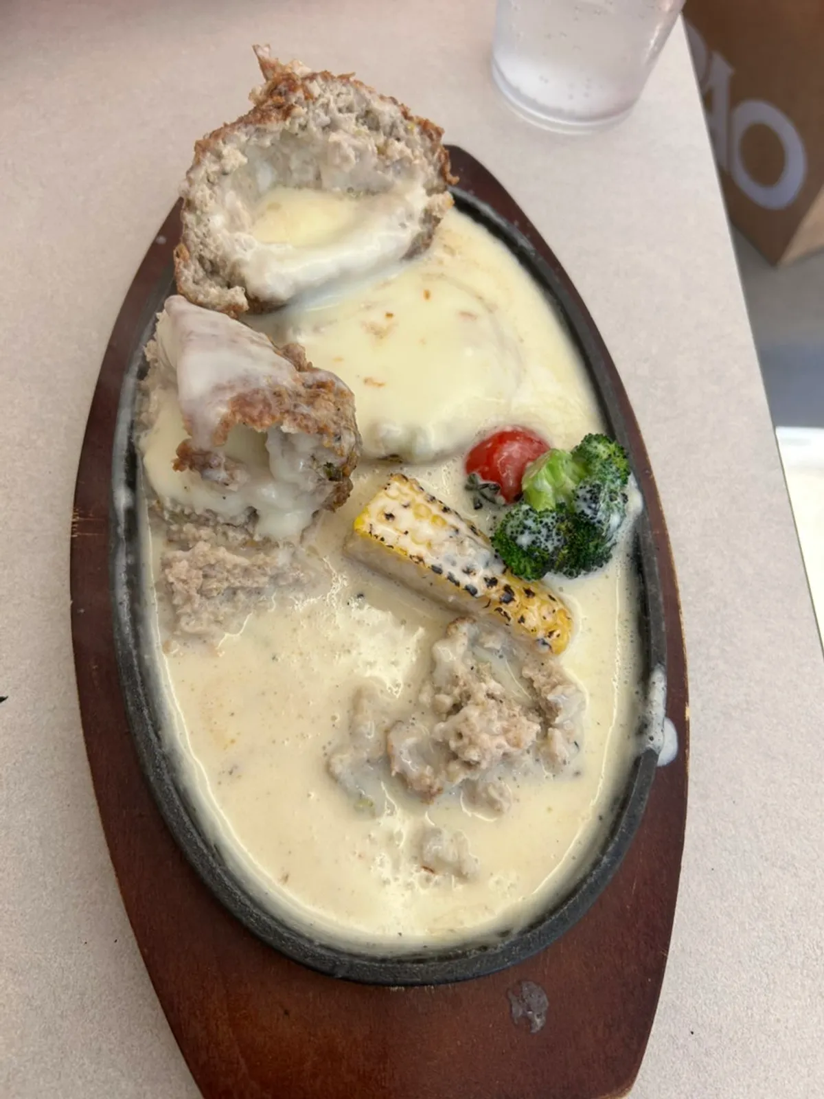Vertical photo of the sizzling cheese cutlet at Omil Hongdae