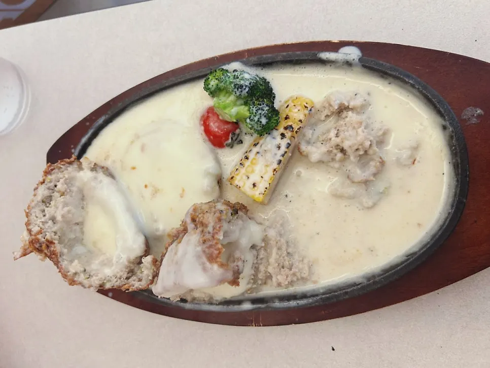 Table setting with sizzling cheese cutlet and salmon gnocchi at Omil Hongdae
