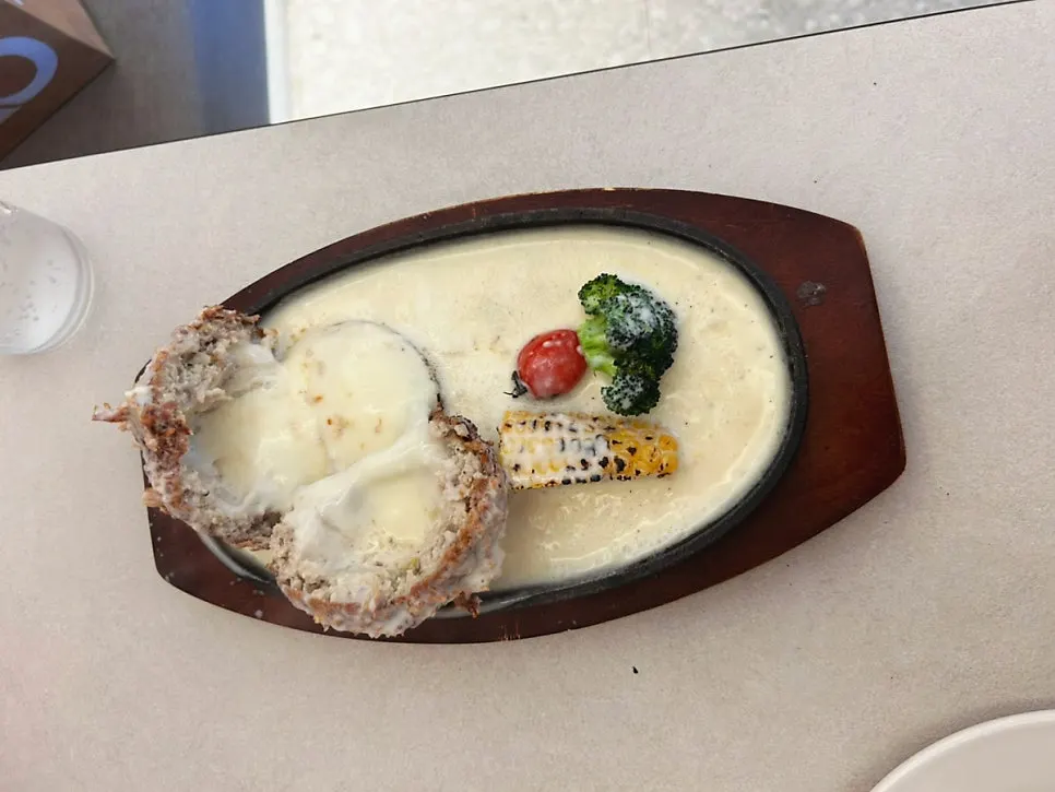 Cross-section of the thick fried cheese cutlet