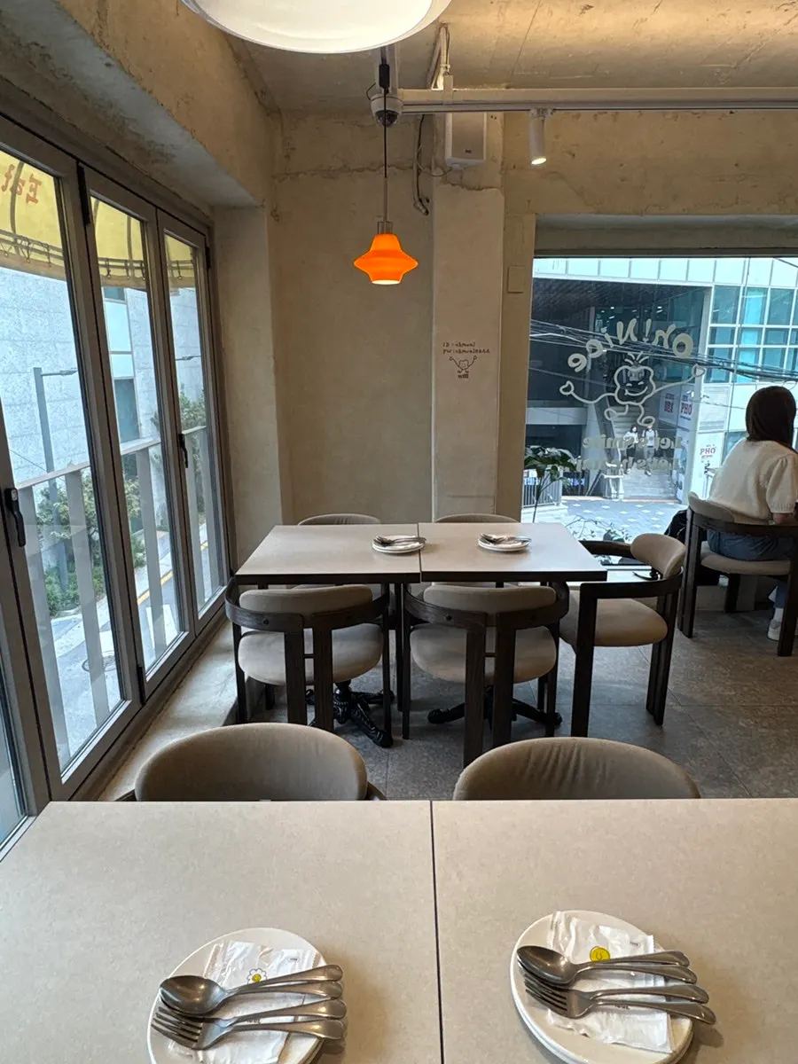 Bright interior of Omil Hongdae's 2nd-floor dining hall