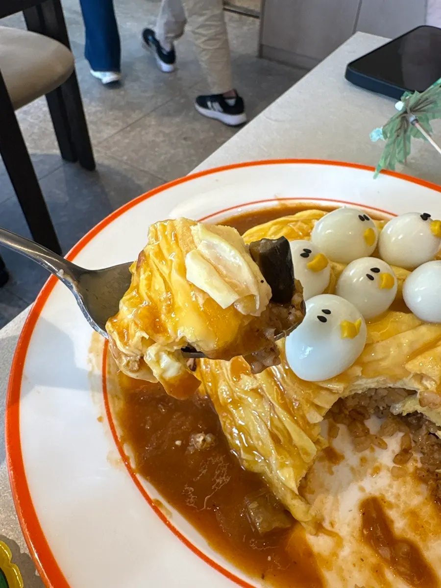 Rubber duck omurice and sizzling cheese cutlet served together