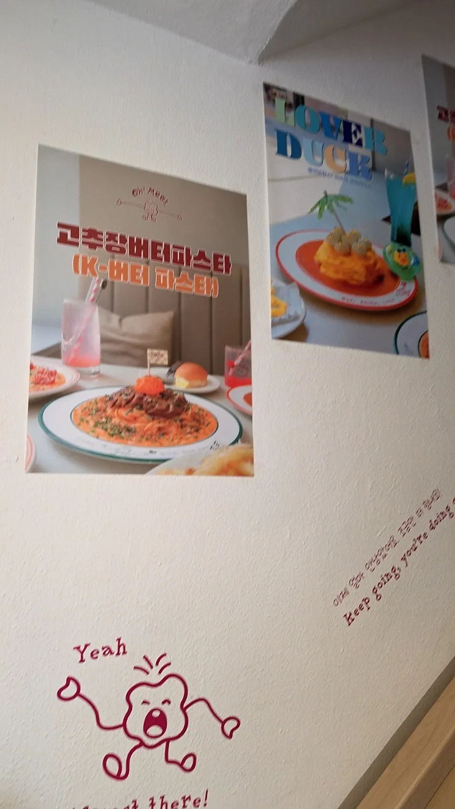 Photos of signature menu items on the stairway wall