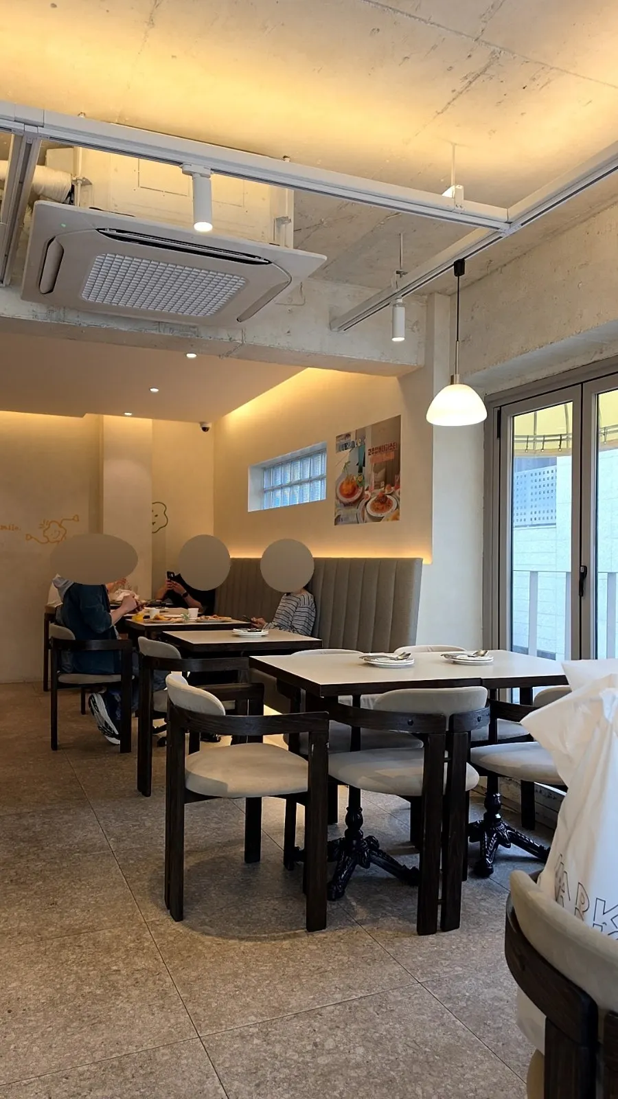 Window seating with floor-to-ceiling windows at Omil Hongdae
