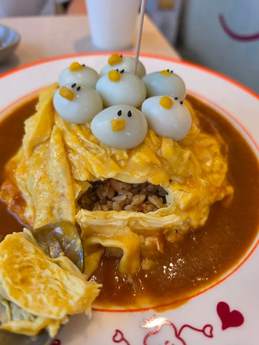 Inside of the omurice fried rice with salmon and vegetables