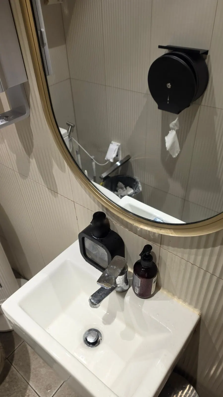 The clean restroom located right outside the store