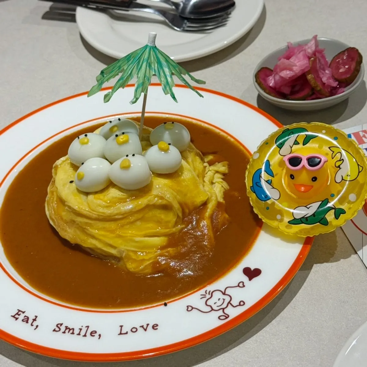 Rubber duck omurice topped with quail eggs